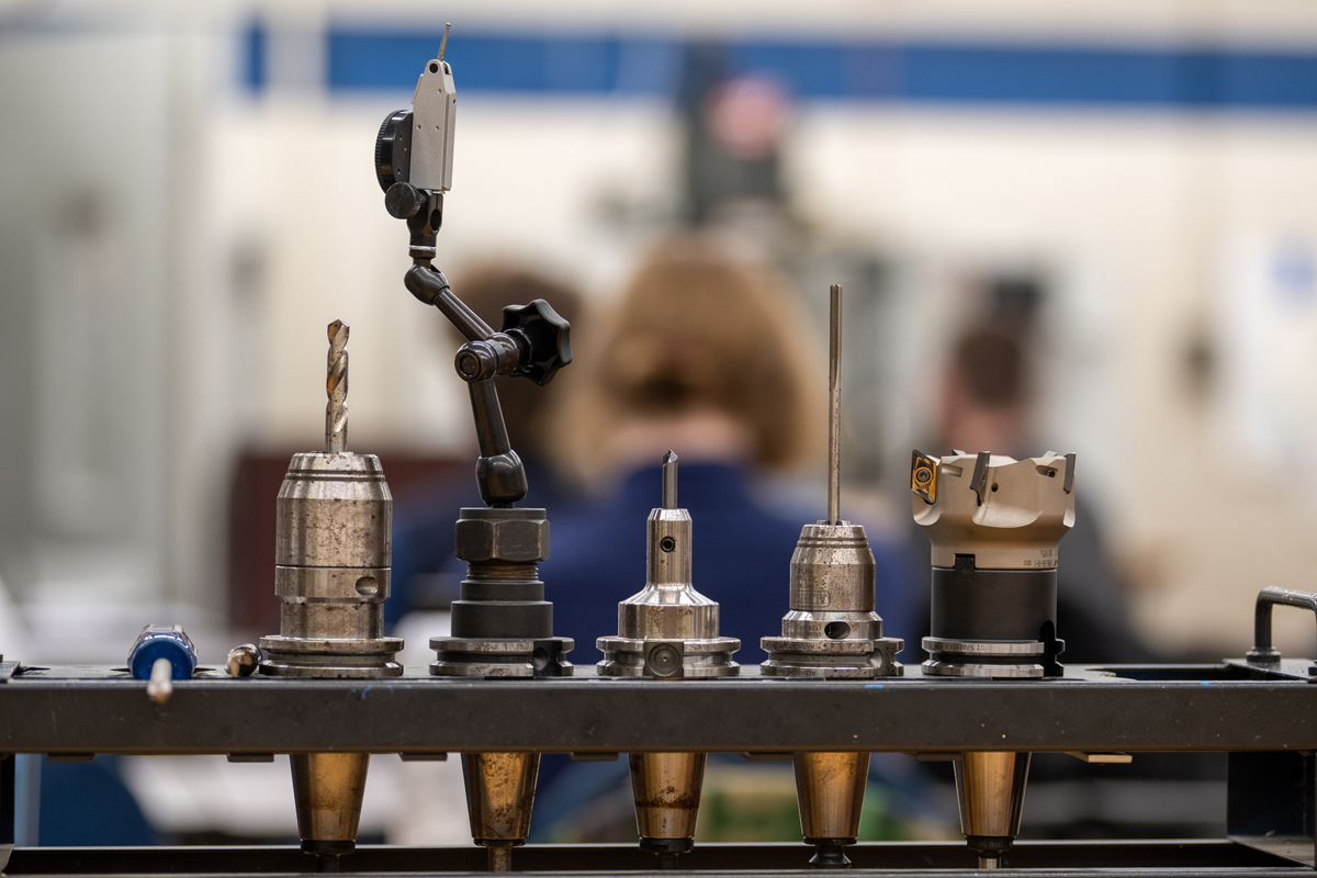 precision machining tools with lab in background