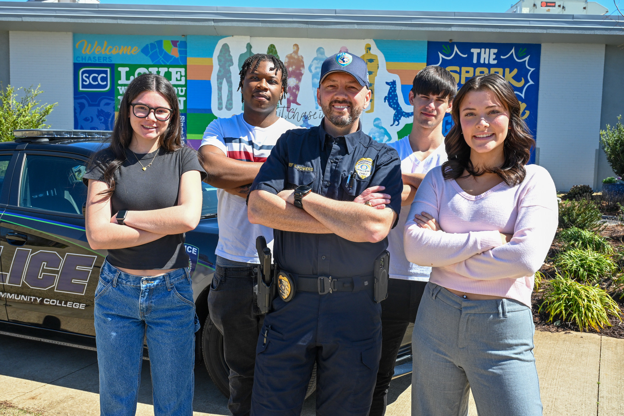Students and police chief smiling
