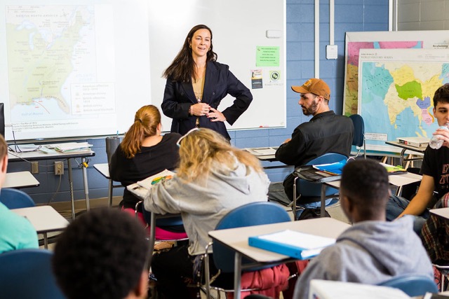 An SCC instructor leads a classroom in discussion.