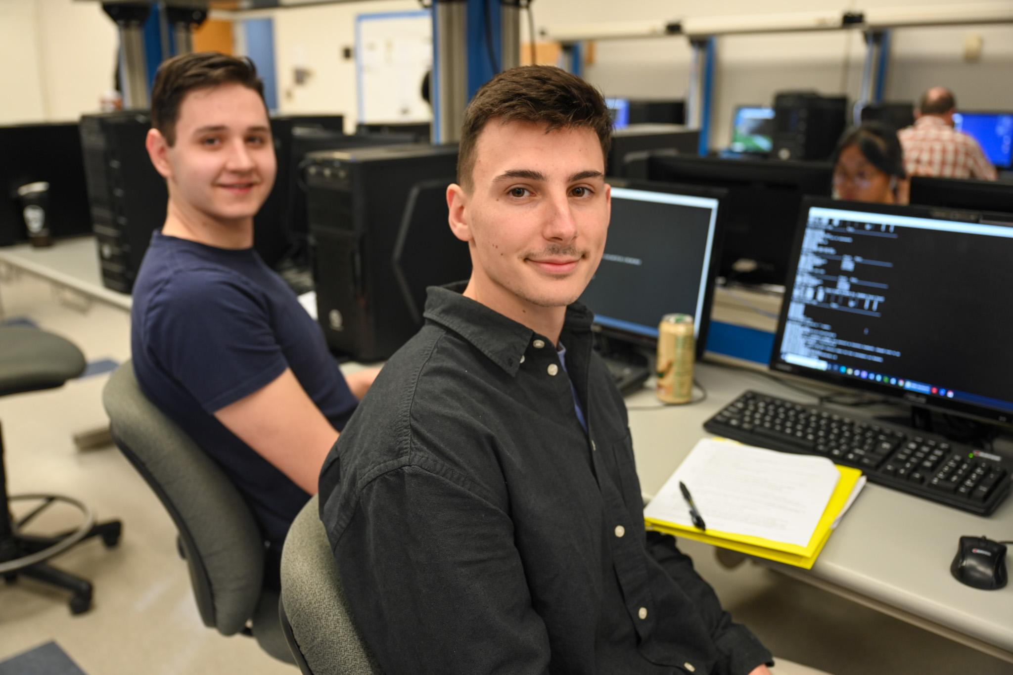 Image of student in front of computers