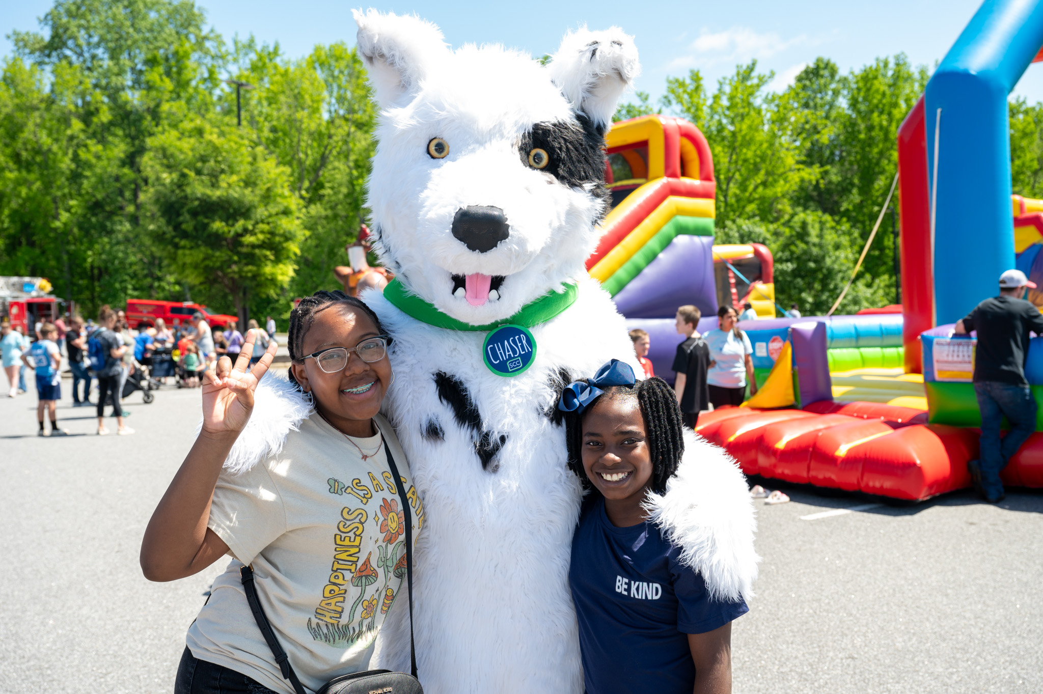 Children pose with Chaser at Spring Fling