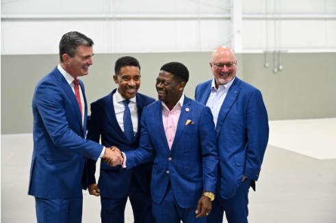 Image of Dr Mikota shaking hands with people from Salt Run Entertainment