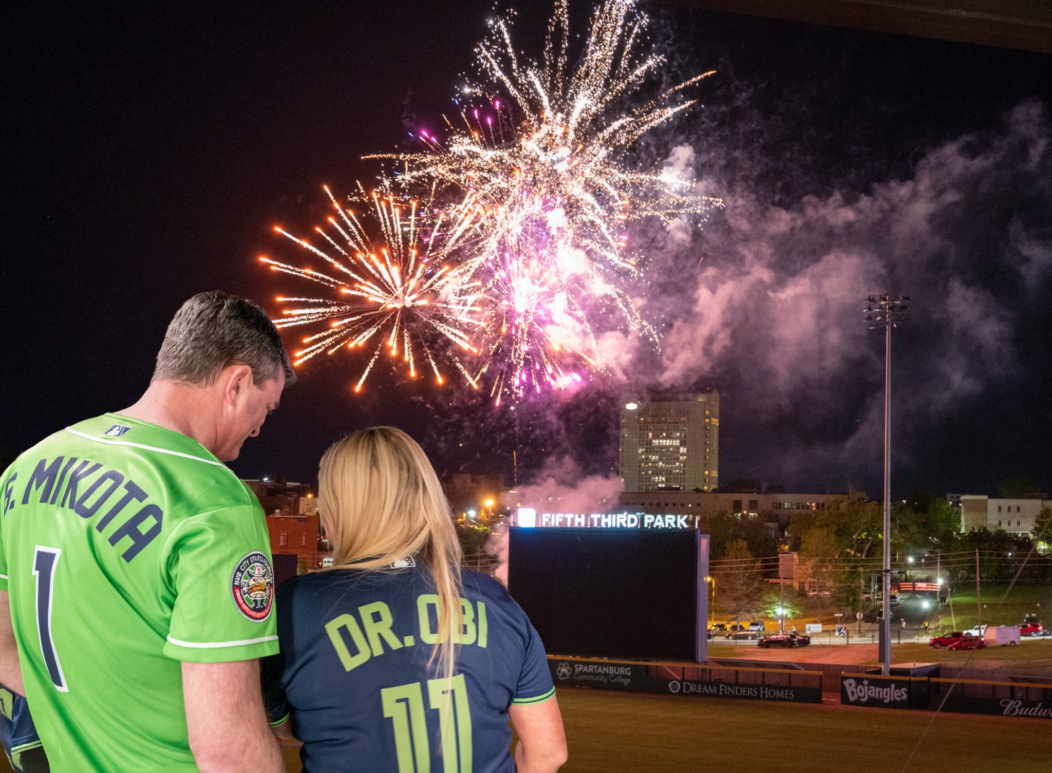 Dr. Mikota and Dr. Obi watch fireworks at Fifth Third Park
