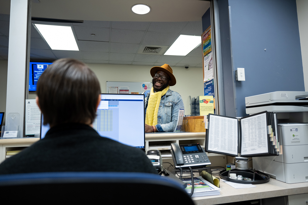 student at service desk